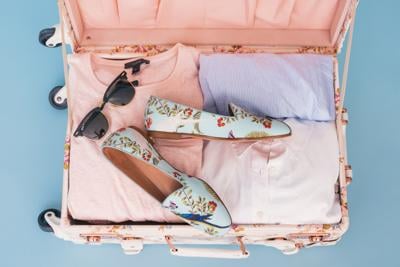 Suitecase packed with co-ords for a getaway weekend