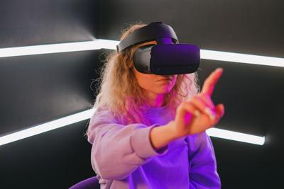 Woman playing one of the hottest VR Games right now