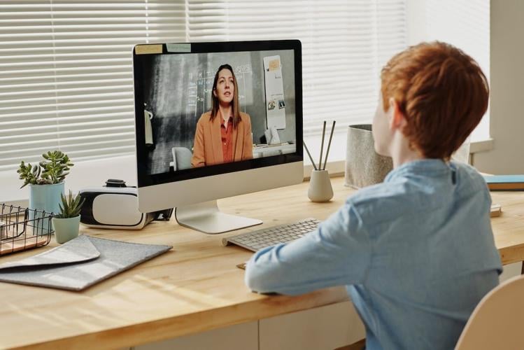 Child attends meeting with teacher in virtual format