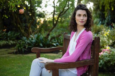 woman on a Garden Benches to Beautify her Backyard