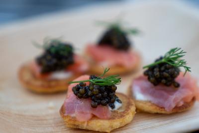 Luxury caviar presented on crackers with other nice foods