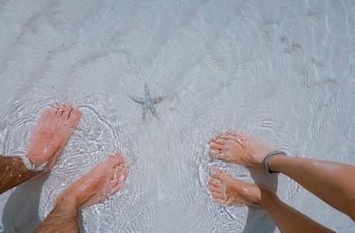 feet soaking in ocean saltwater Remedies for Toenail Fungus