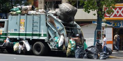 Trash truck removes waste like those in Manly, Australia