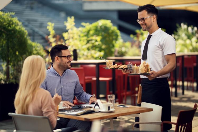 Waiter serving food