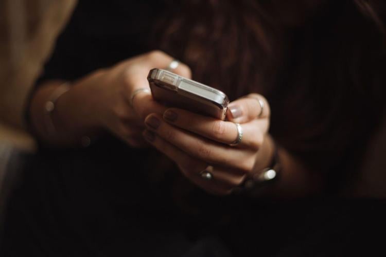 Woman uses her very expensive smartphone