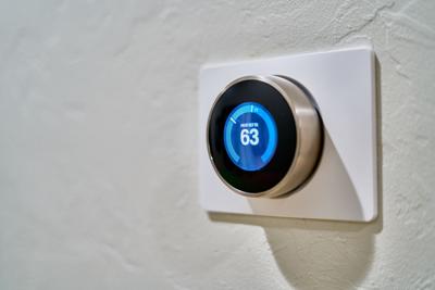 Thermostat shows temperature set to a low setting, helping conserve energy