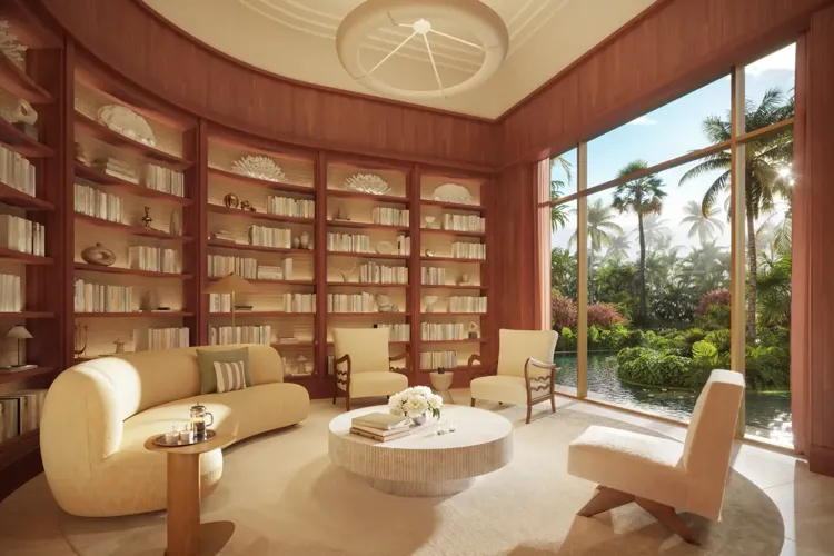Luxury residential library at Ocean Terrace in Miami Beach with curved shelving, rattan details and garden views