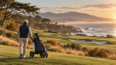 Golfer walking a coastal golf course with a push cart during golden hour in fall.