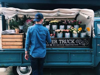 a guy picking anniversary flowers