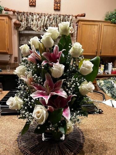 A Flower Arrangement on a table as Birthday Gifts