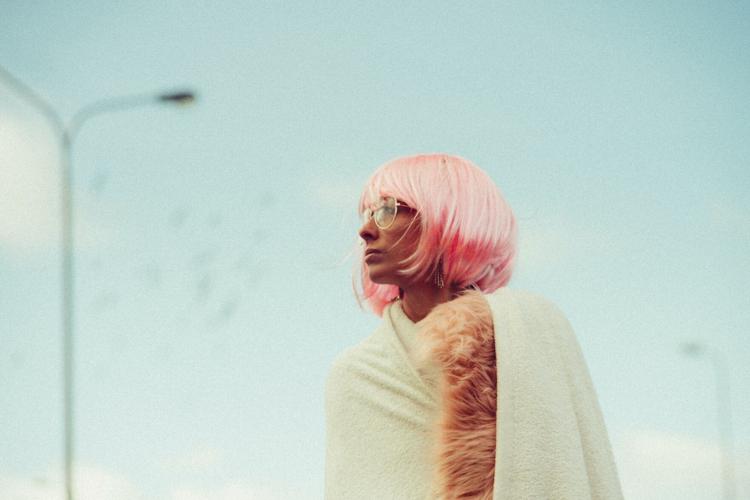 Woman wearing pink bob wig