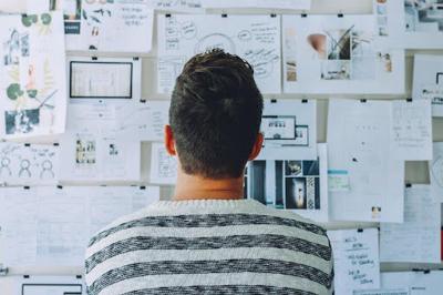 a guy looking at the Important Things to Consider Before Building a Startup