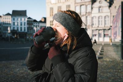a women trying to save money on heating bill