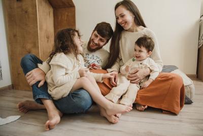Family sits on perfect floor type for their family