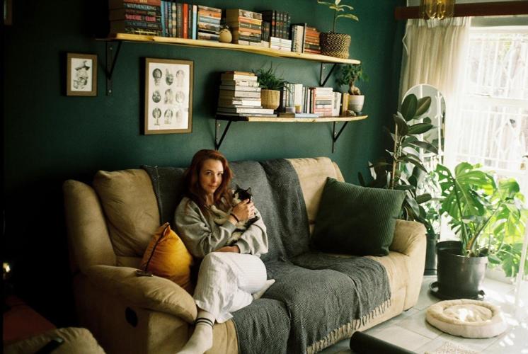 pexels.com-photo/cozy-living-room-with-woman-and-cat-33329998