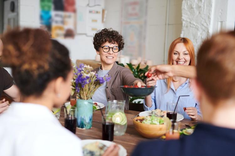 Friends seated at a table during a dinner party