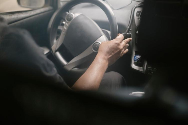 Person drives their car, knowing road safety rules and tips