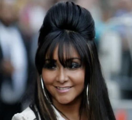 Woman wears her hair in a large pouf