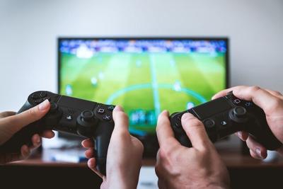 To friends play video game to unwind and relax after mentally stressful day