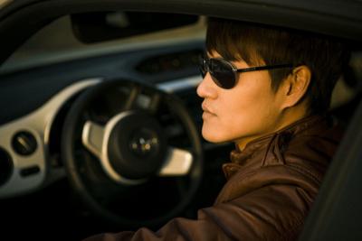 a man in a car with Masculine Style very handsome