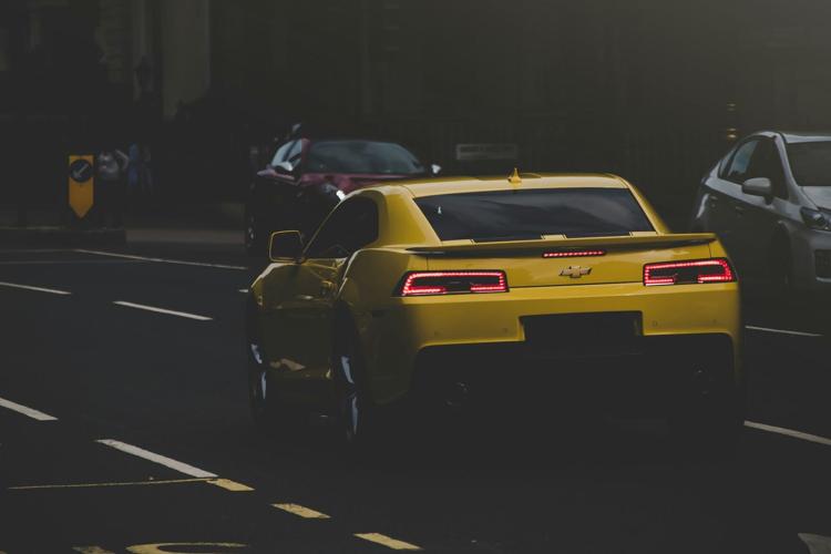 A yellow luxury vehicle that is someone's dream car