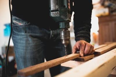 Person drills into piece of wood using new technology to help him stay competitive
