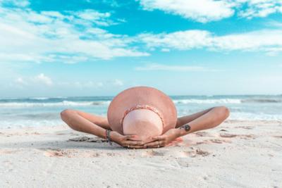Woman relaxes on the beach during her perfect vacation