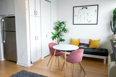 This studio apartment utilizes great decor and storage techniques to make a cozy space