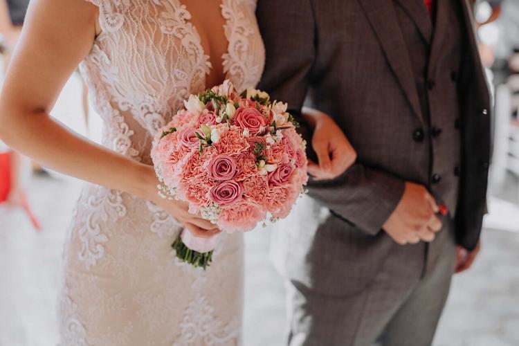 Bride walks down the aisle in the perfect wedding dress