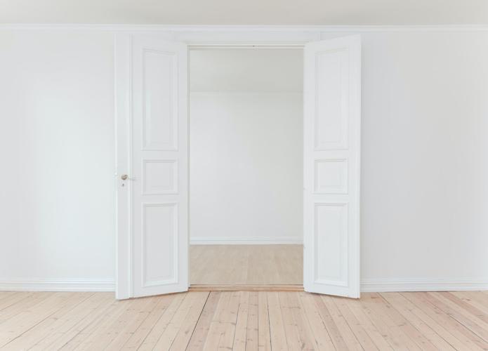 Double doors open into other room, showing a potential investment property