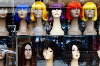 Window display of a variety of wigs