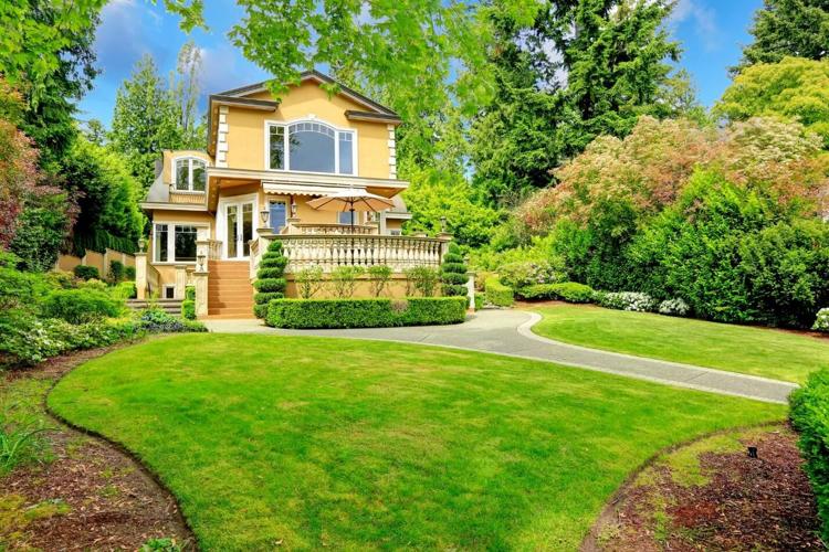 A beautiful yellow home with impact windows to protect the family