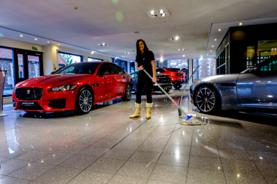 Car dealership cleaning services preserve finishes, lighting, and buyer perception