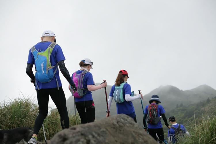 People walk down trail on weekend hike