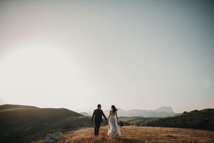 Couple poses for wedding pictures during their wedding in Mexico