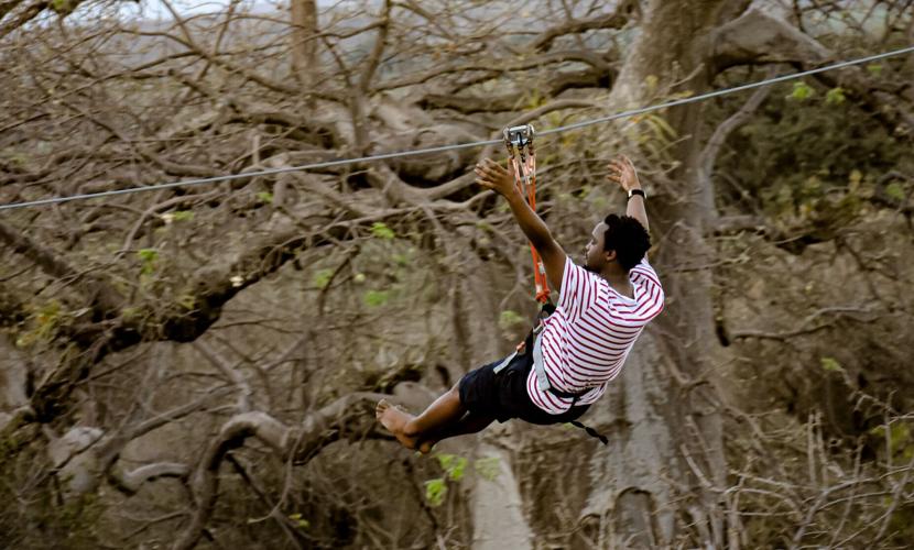 Man on an adventurous zipline during a holiday