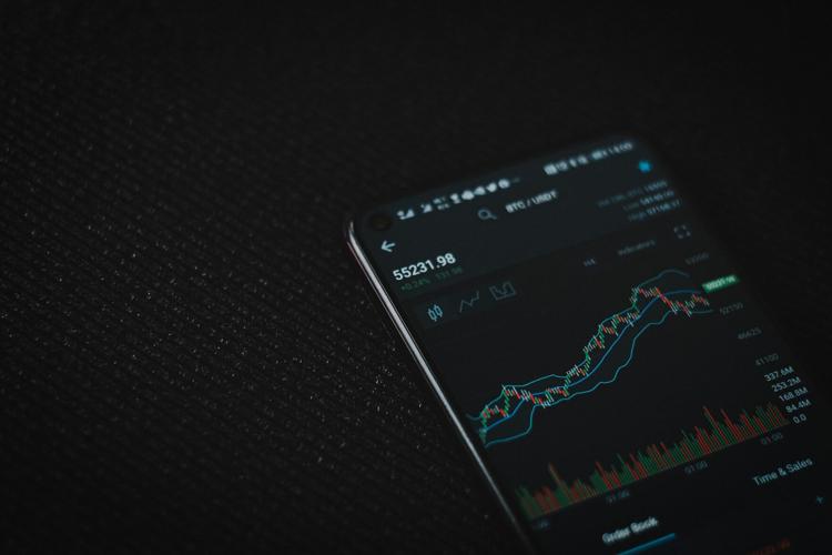 Person checks ETFs on their mobile phone