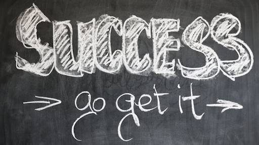 A chalkboard with the words Success Go Get It written on it.