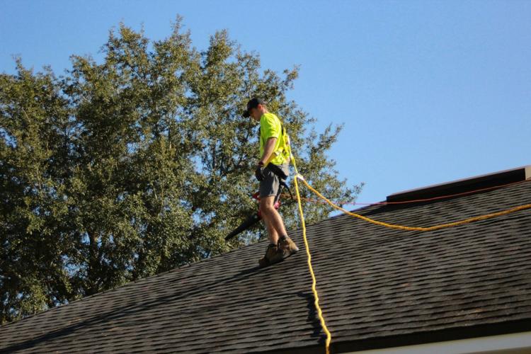 Person conducts a crucial regular roof inspection