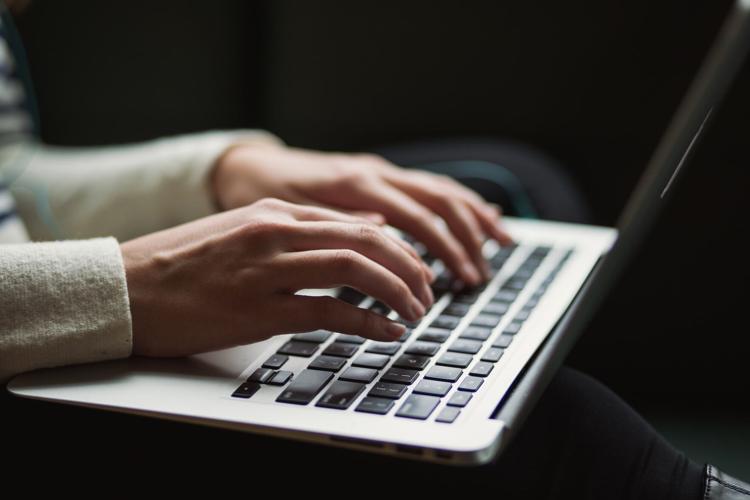 Woman uses artificial intelligence to support her computer work