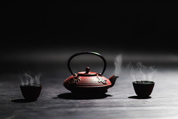 A teapot and two tea cups that are part of a balanced lifestyle