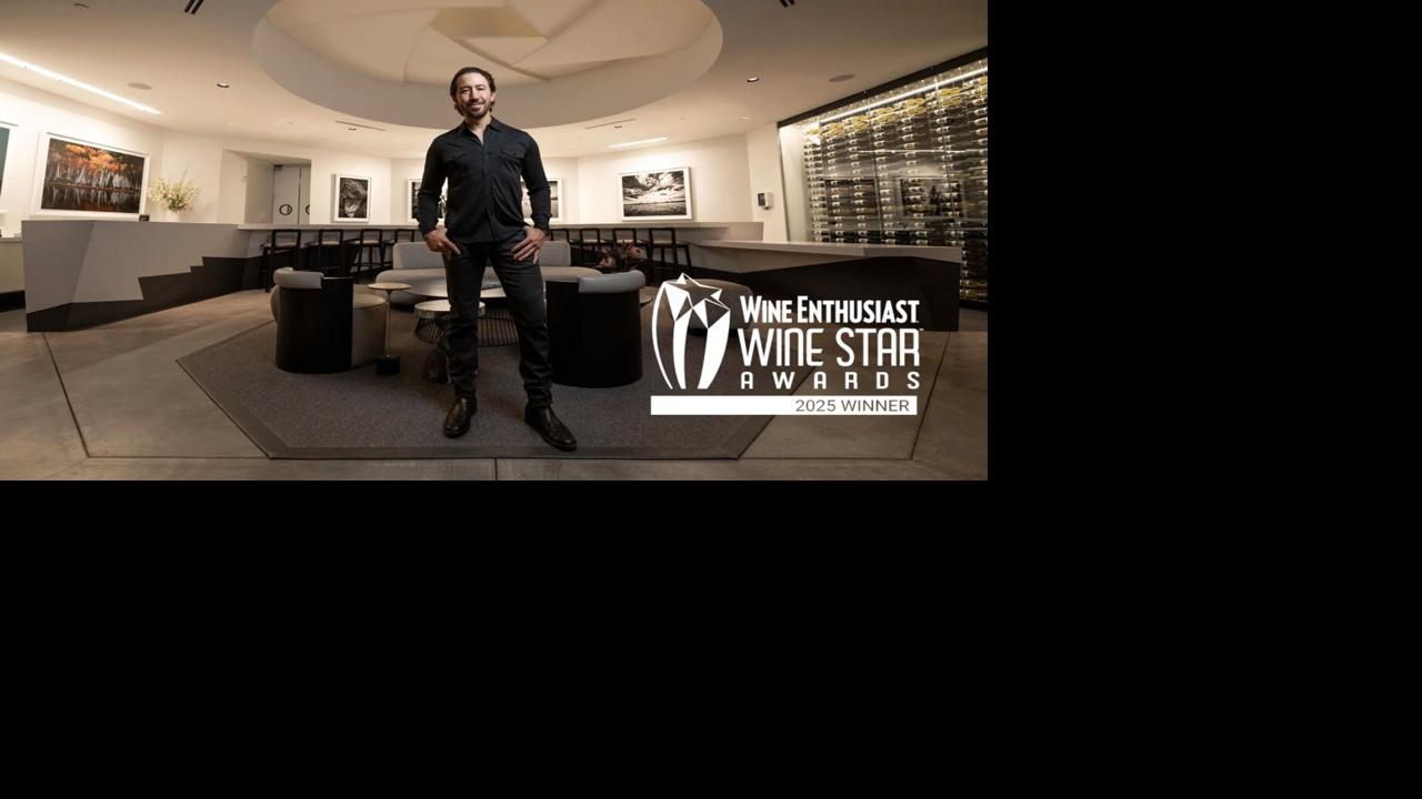 Man standing with award tag