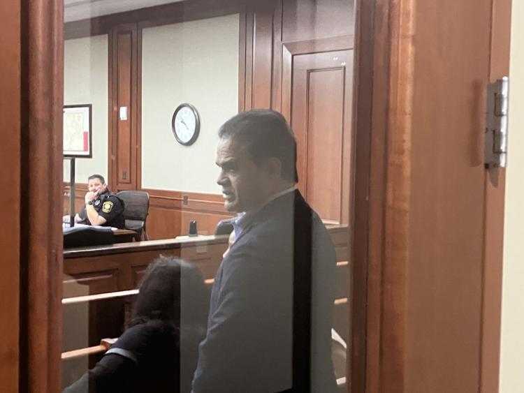 UPDATED arrested on two counts of money laundering County