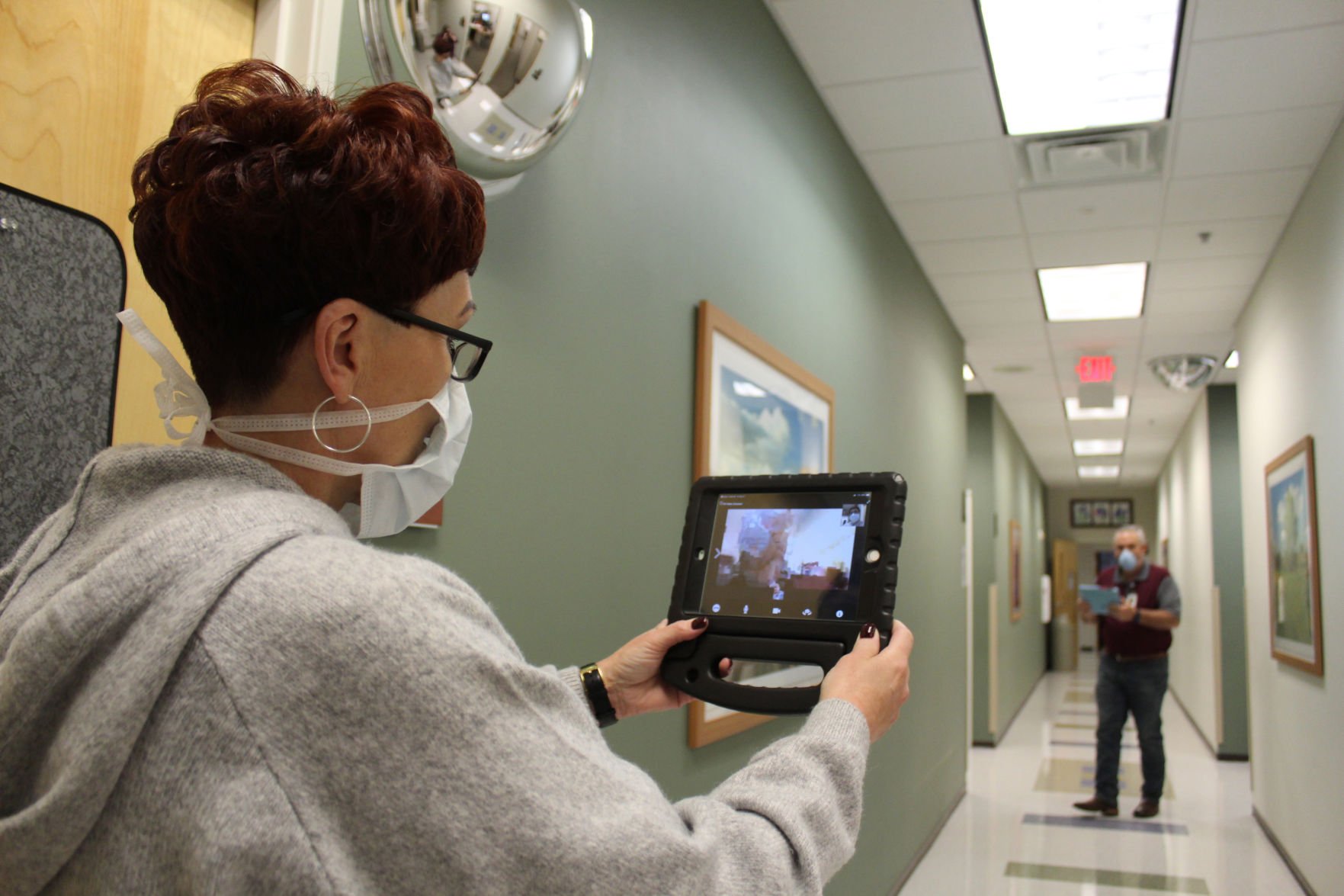 Nicole Hawkins, a health system administrator, and Ronald Twitchel, a clinical workflow analyst, show how Virtual Video Visit works, Friday, at the Killeen Medical Home, a CRDAMC health clinic in Killeen. The program allows doctors to see their patients virtually.