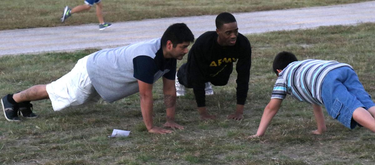 Wagonmaster troopers help students, dads with fitness day