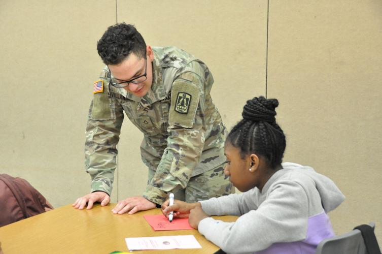 Elementary school celebrates early Valentine’s Day with troops Living