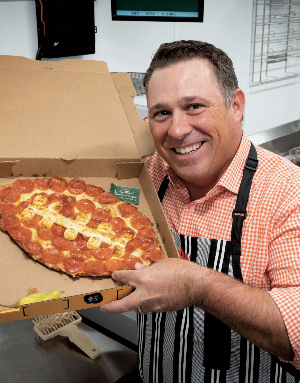 Papa Johns debuts football-shaped pizza