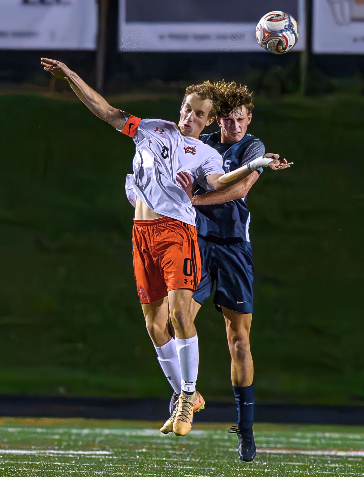 Urbana Boys Soccer 2024 players Dom Giannini and Zach Ledder competing for a header
