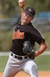 Baltimore Orioles starting pitcher Cory Morris (57) sets to make his pitch  during the first inning against the Minnesota Twins during their spring  training baseball game in Ft. Lauderdale, Fla. Thursday, March