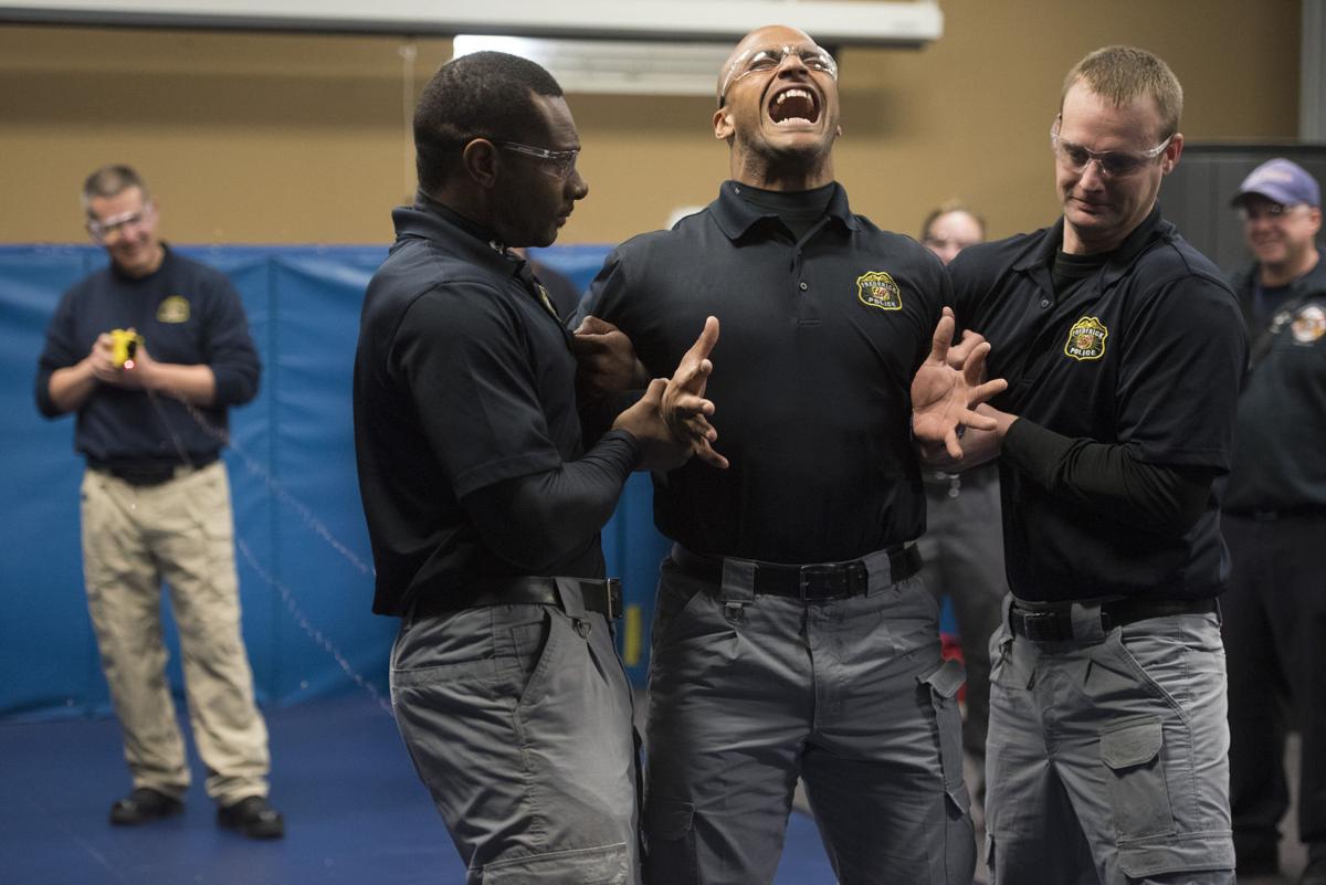 Earning The Badge Recruits Test Tools Of The Trade Trying Tasers Pepper Spray Police Academy Fredericknewspost Com